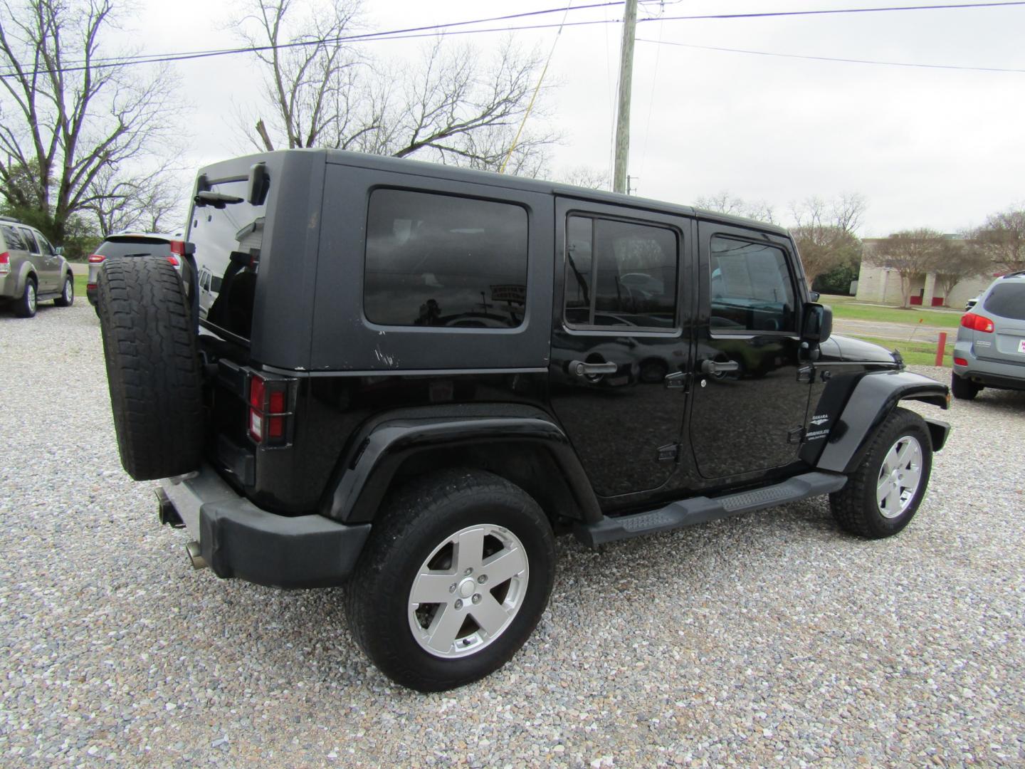 2008 Black Jeep Wrangler Unlimited Sahara 4WD (1J4GA591X8L) with an 3.8L V6 OHV 12V engine, Automatic transmission, located at 15016 S Hwy 231, Midland City, AL, 36350, (334) 983-3001, 31.306210, -85.495277 - Photo#7